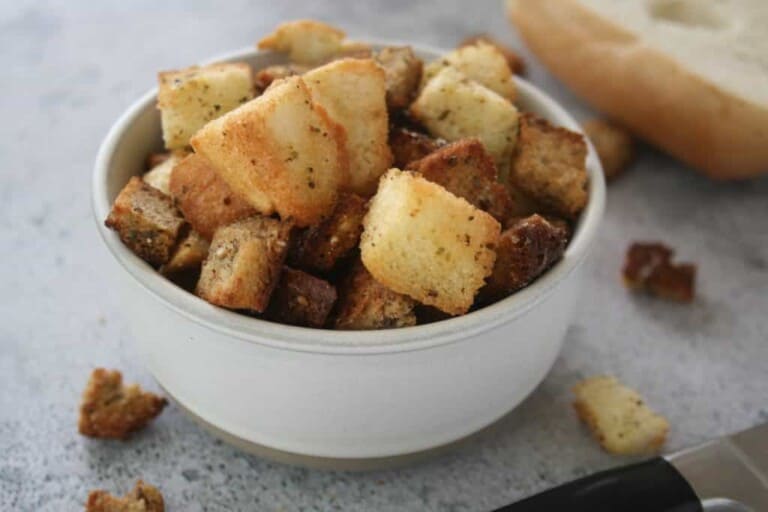 croutons in white bowl side view