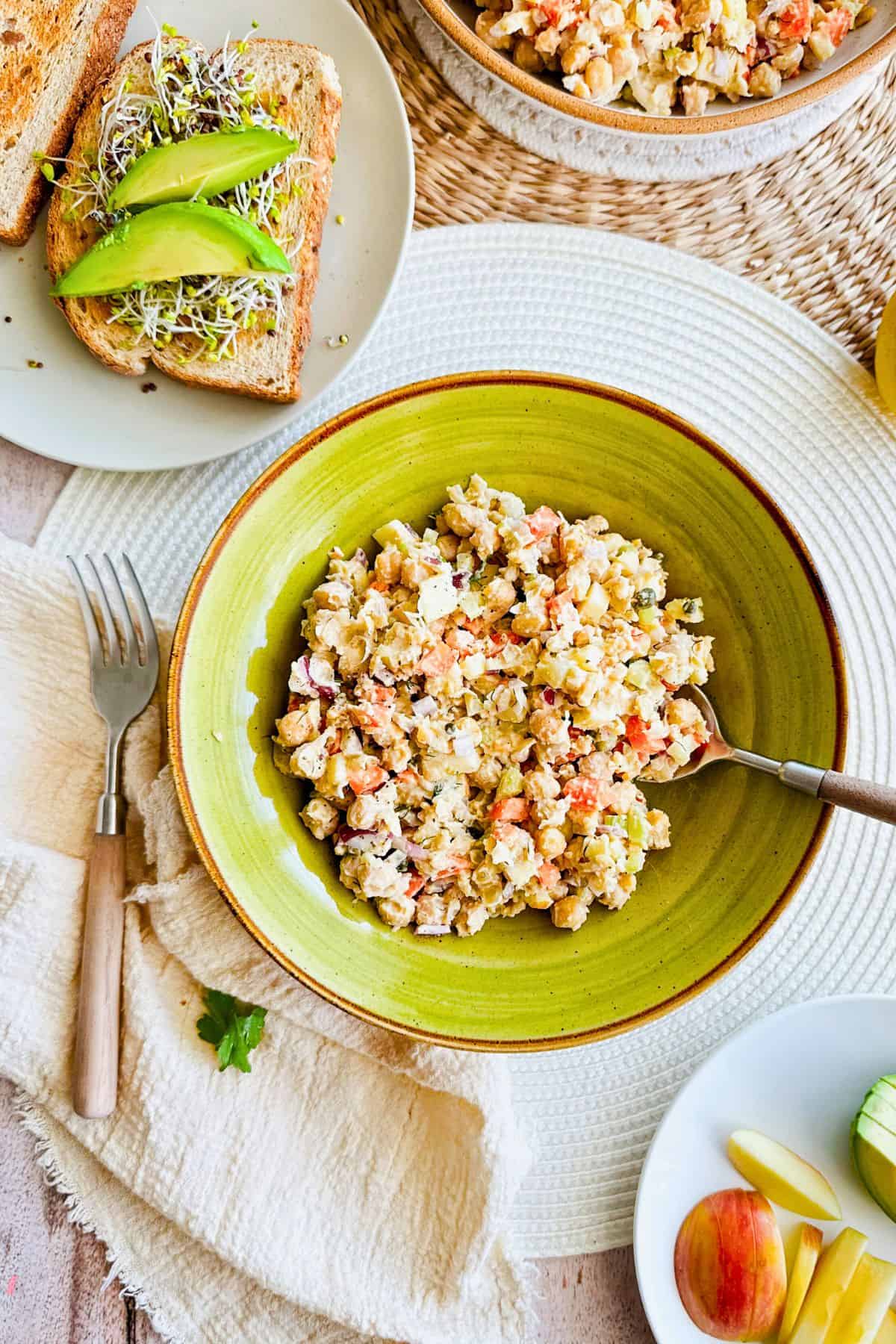 chickpea salad with pretzels vegan chickpea tuna salad in a bowl with a spoon.