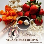cover for 10 delicious vegan fondue recipes with chocolate fondue and fondue forks holding a marshmallow and dried apricot; bowl is surrounded by other dippers.