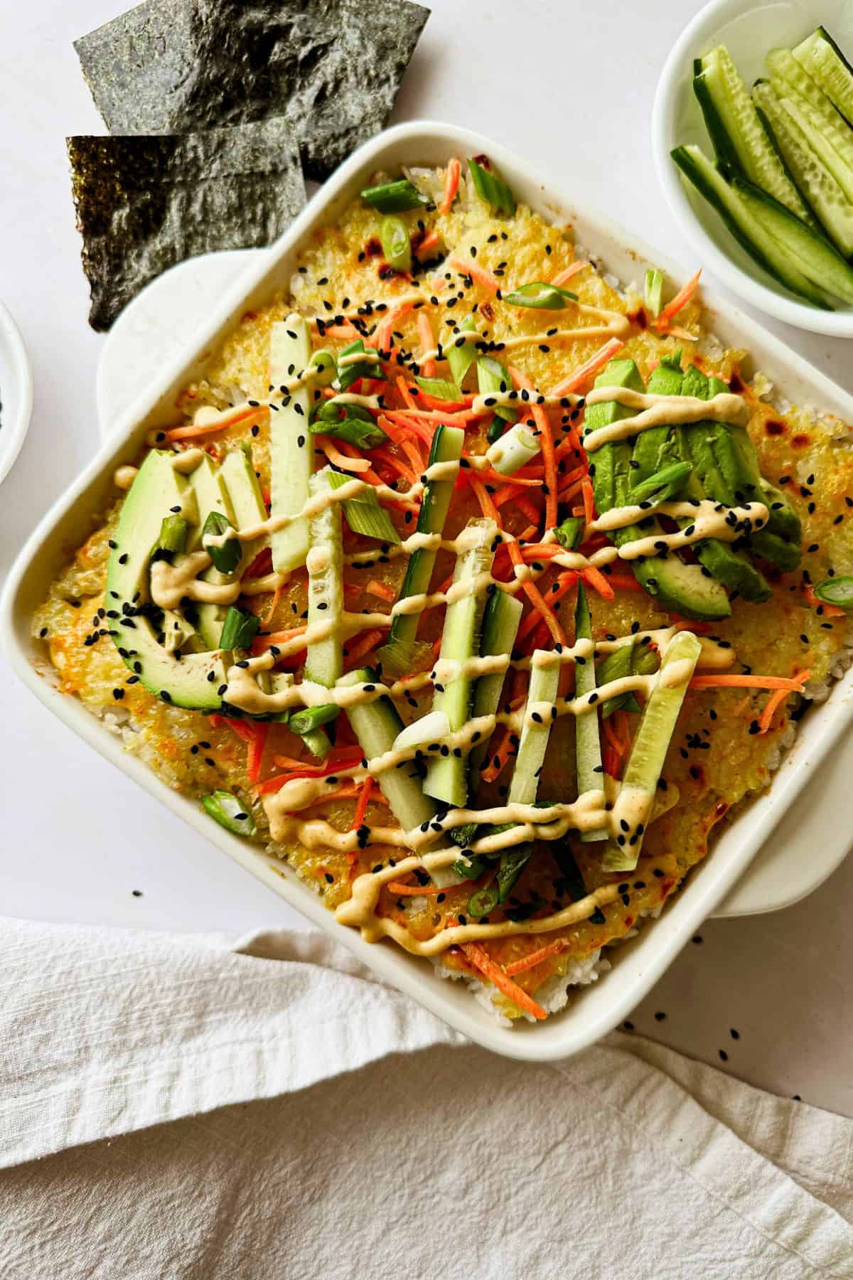 top view of vegan sushi bake with the garnishes