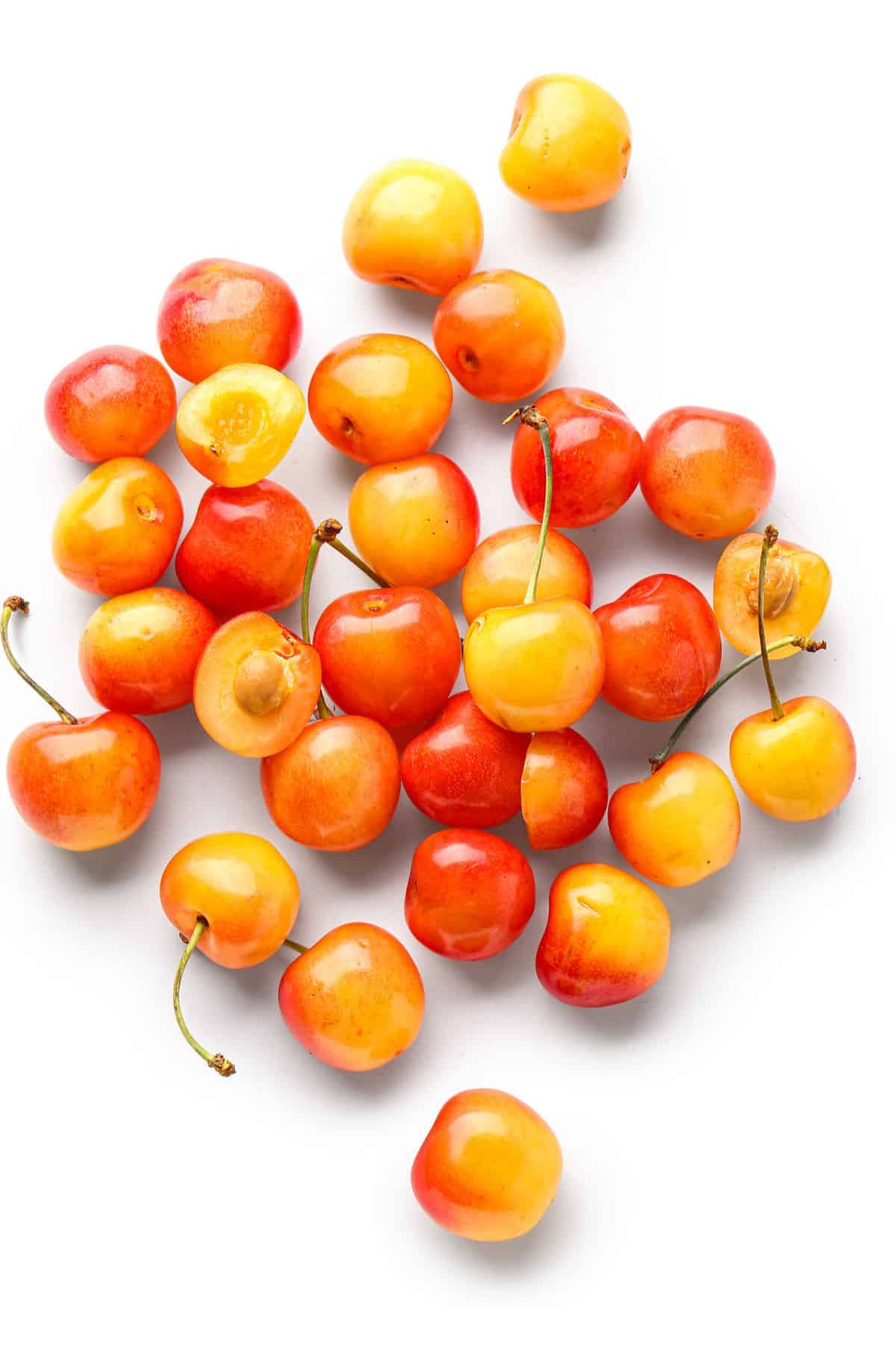 Yellow cherries on a white background