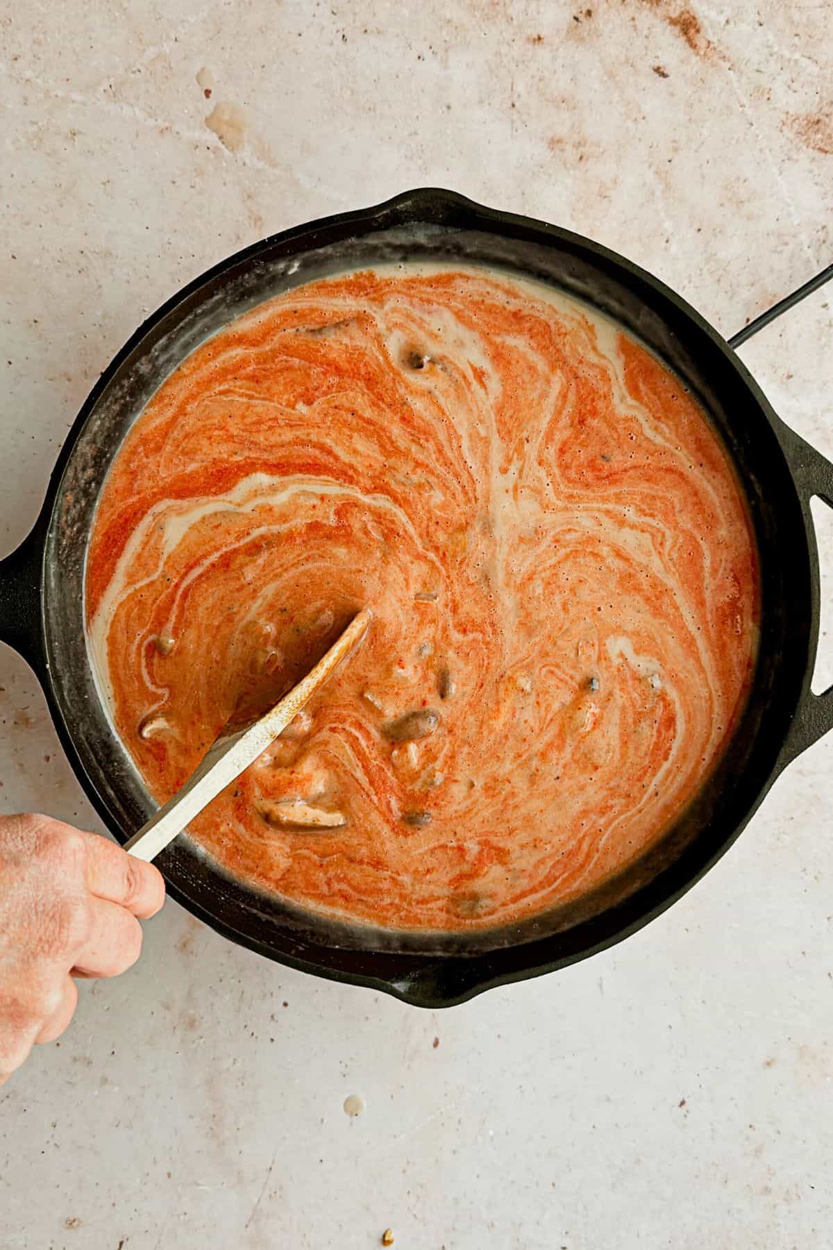 add tomato puree to pan