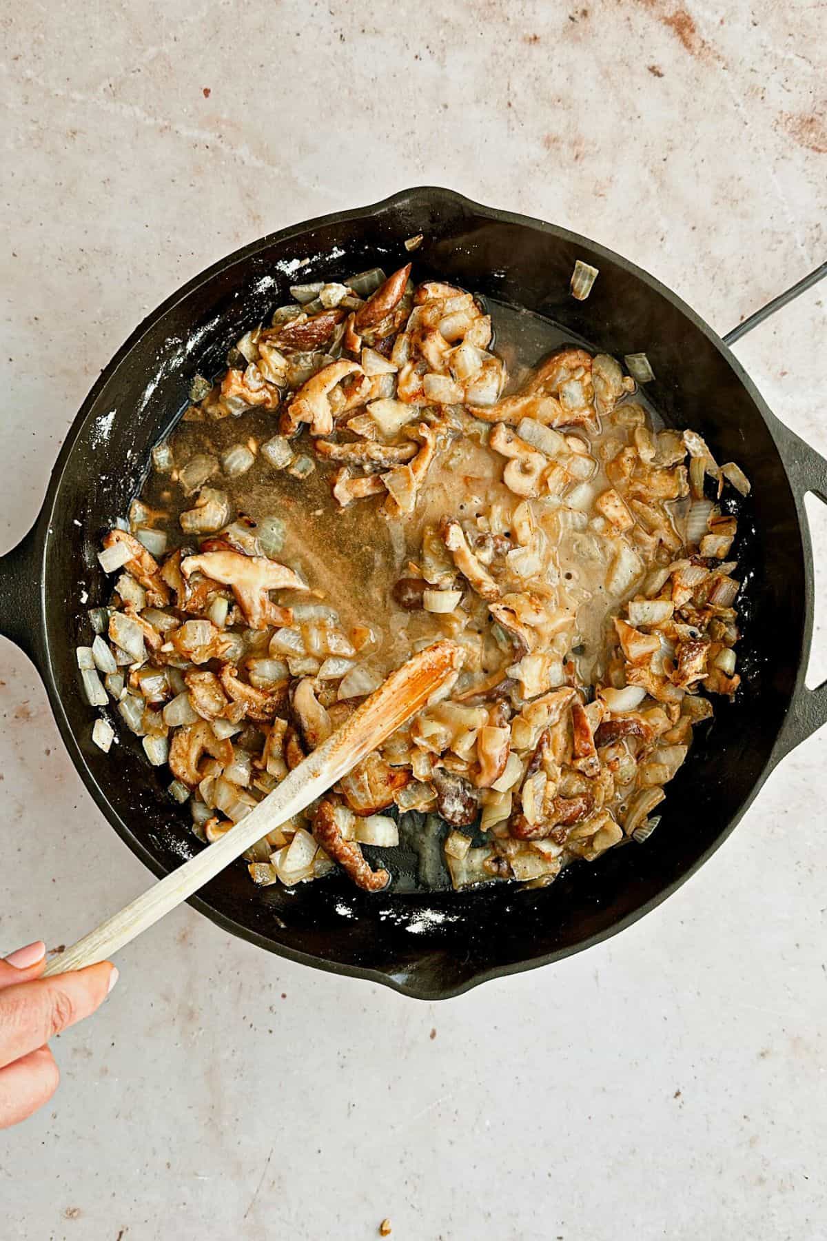 add veggie broth to pan