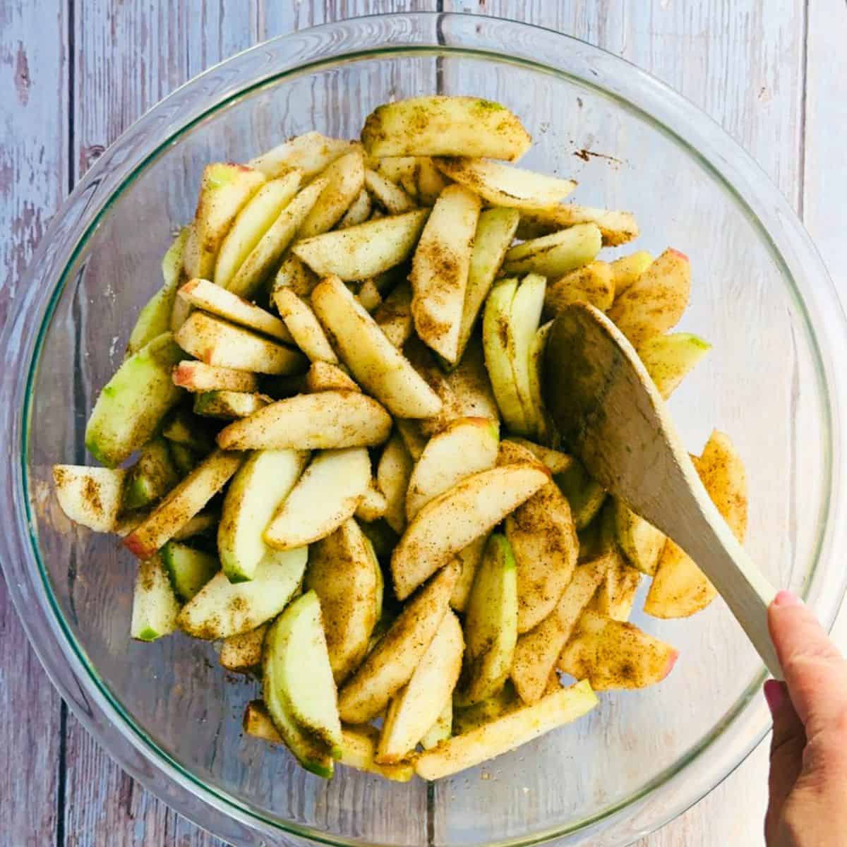 mixing the apple crisp filling ingredients