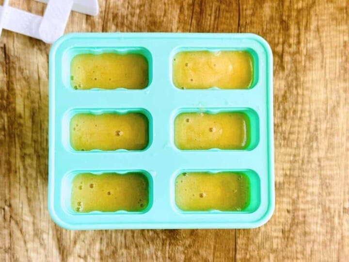 banana mixture in popsicle molds without lids