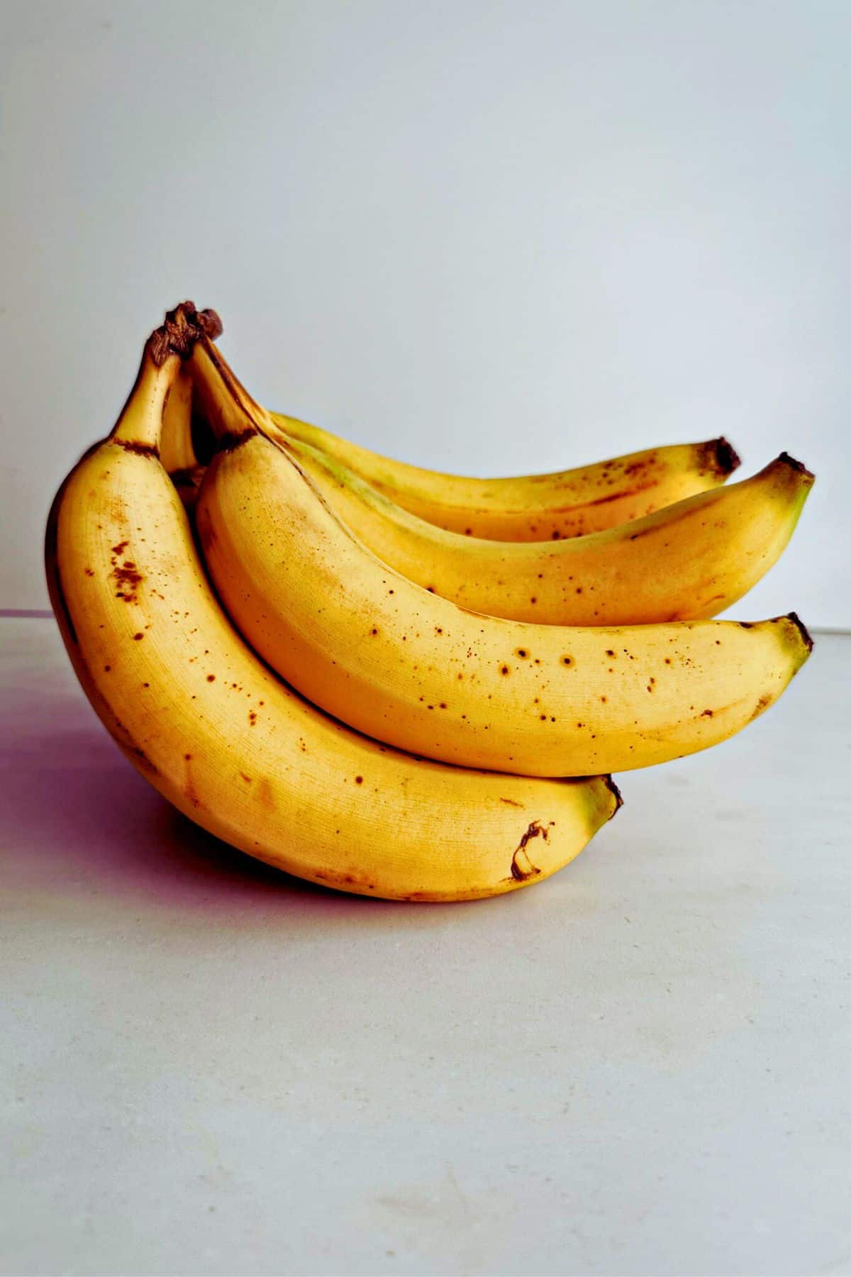 bunch of bananas on a gray background