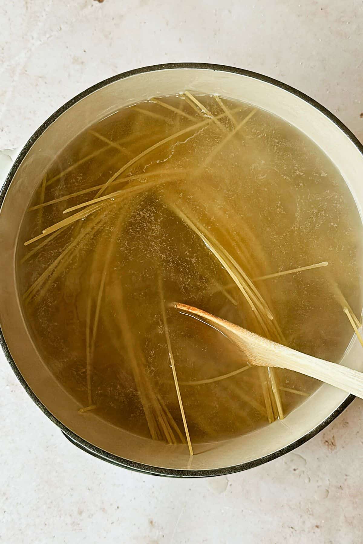 top view of boiling pasta in a pot.