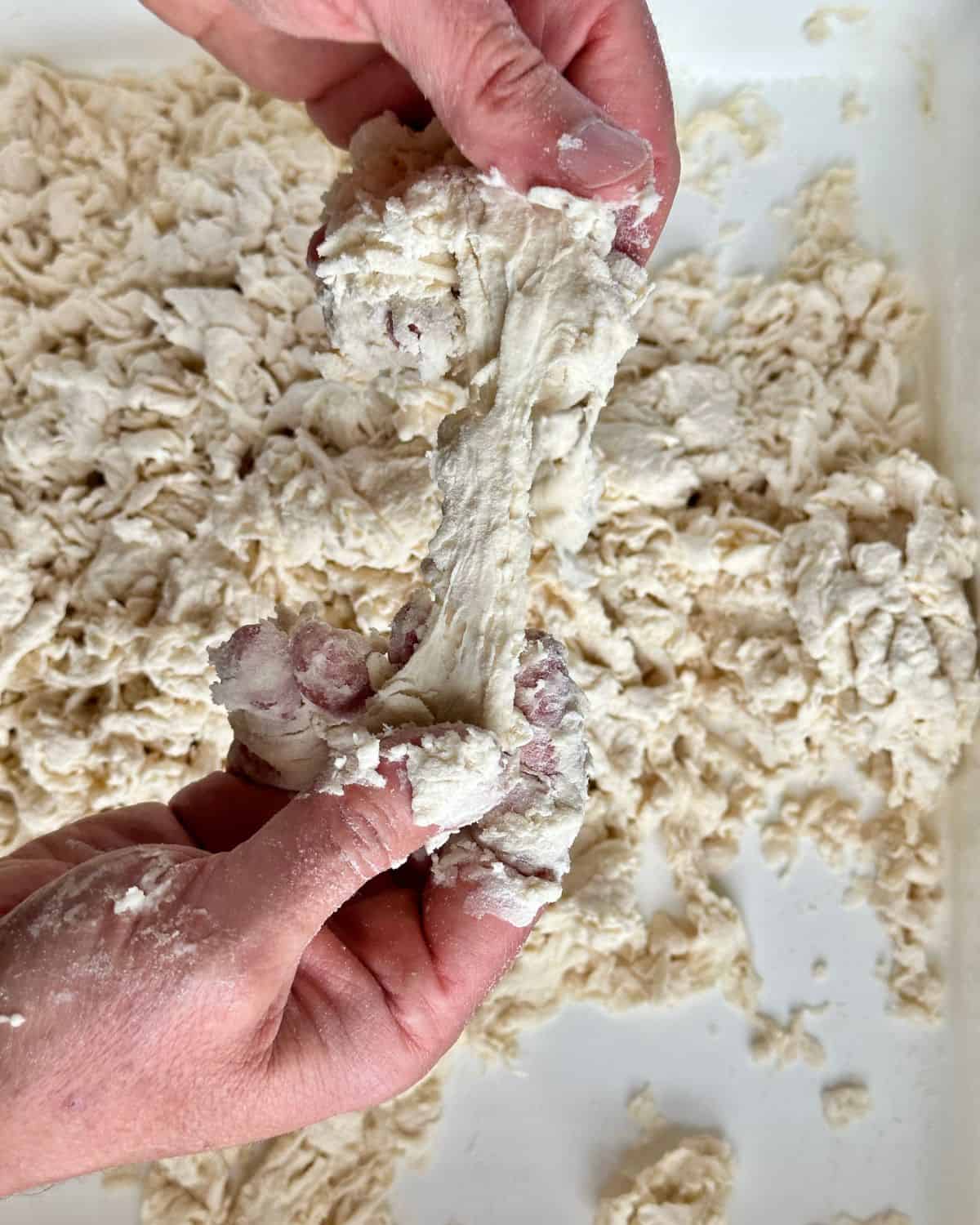 Pull some of the larger pieces of biga apart, you'll notice some moist centers that you can use to collect any remaining flour.