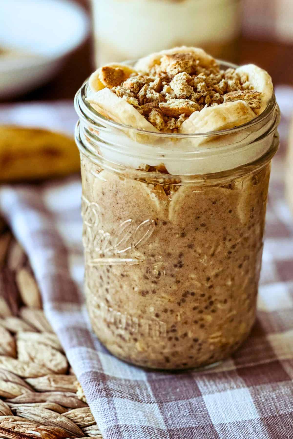 side view of high protein vegan banana cream pie overnight oats in a mason jar