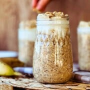 side view of high protein vegan banana cream pie overnight oats in a mason jar