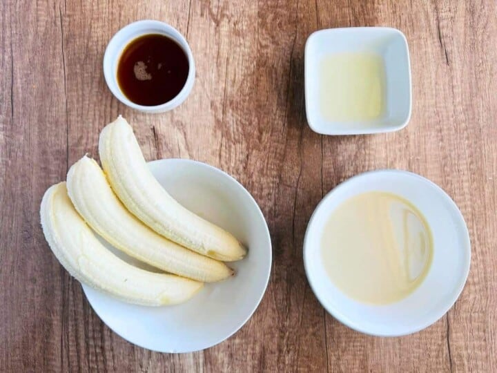 ingredients for banana popsicle in bowls; top view