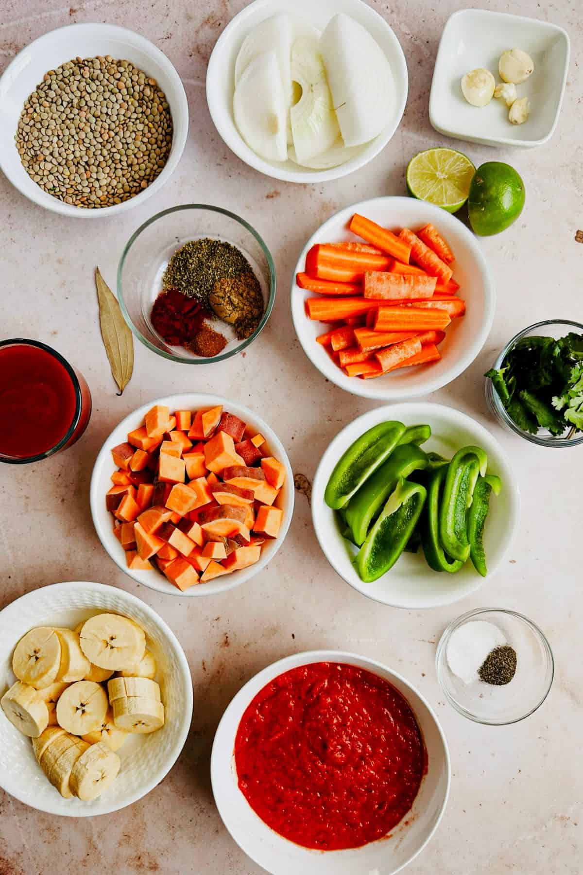 ingredients for vegan cuban lentil soup in bowls top view