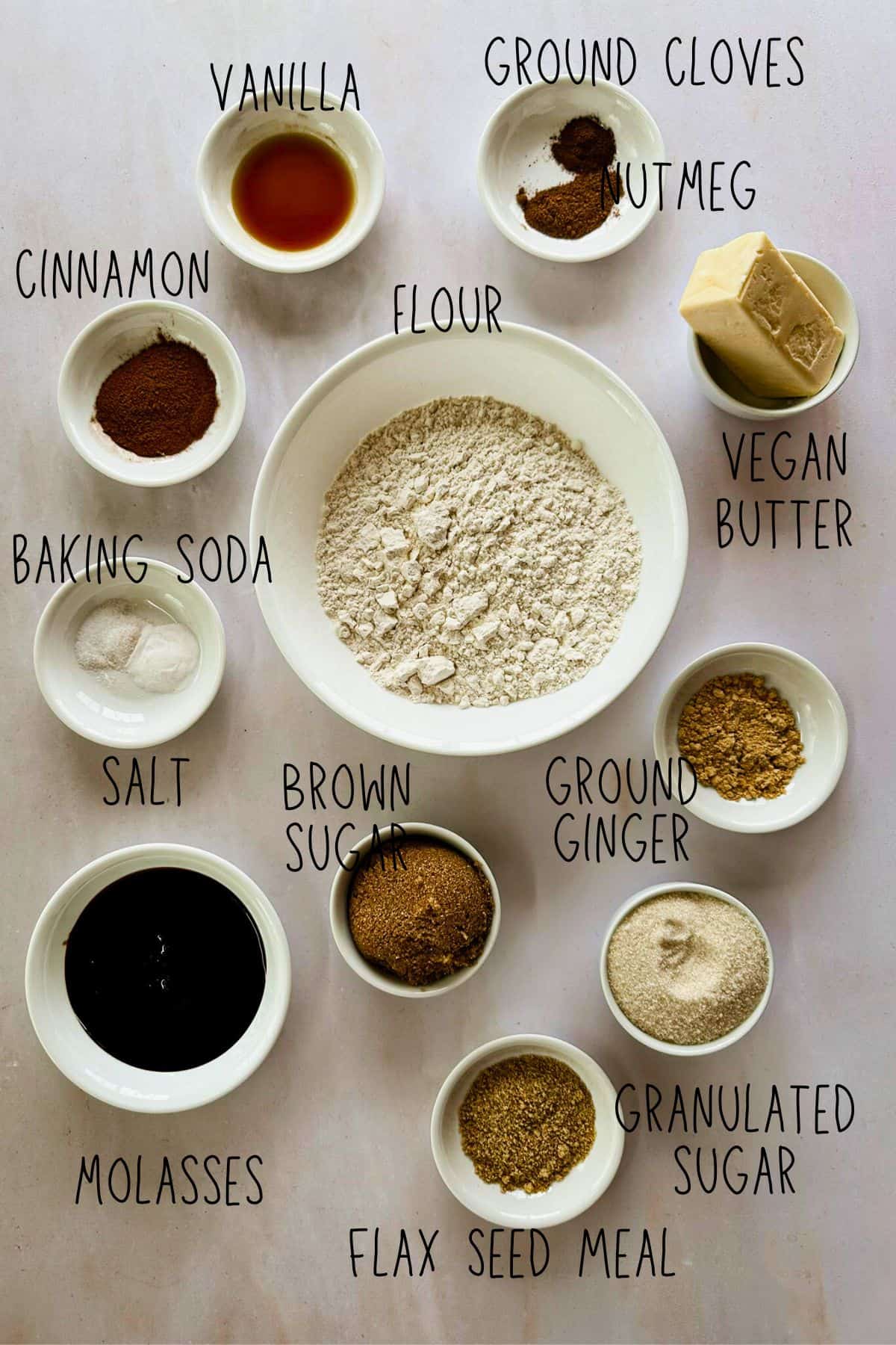 ingredients for vegan soft gingerbread cookies in bowls top view