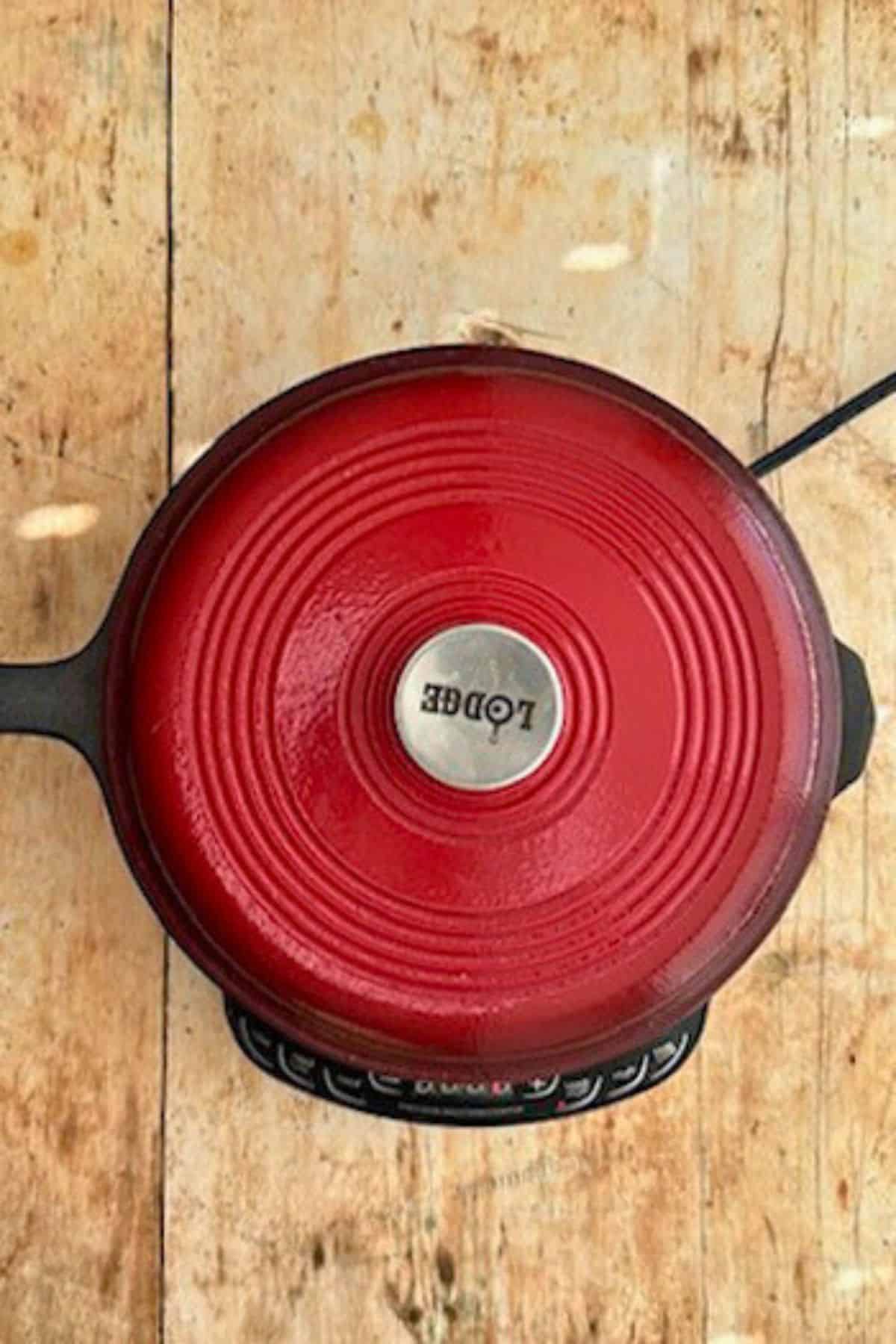 lid on a pan to melt the cheese