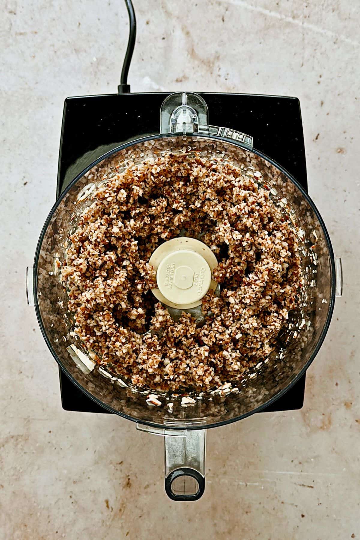 top view of mushrooms in food processor.