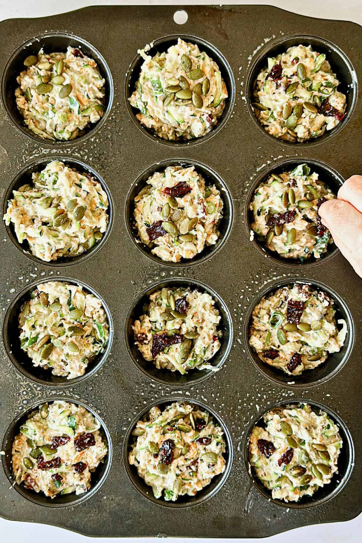 top view of muffin tin with raw muffin batter