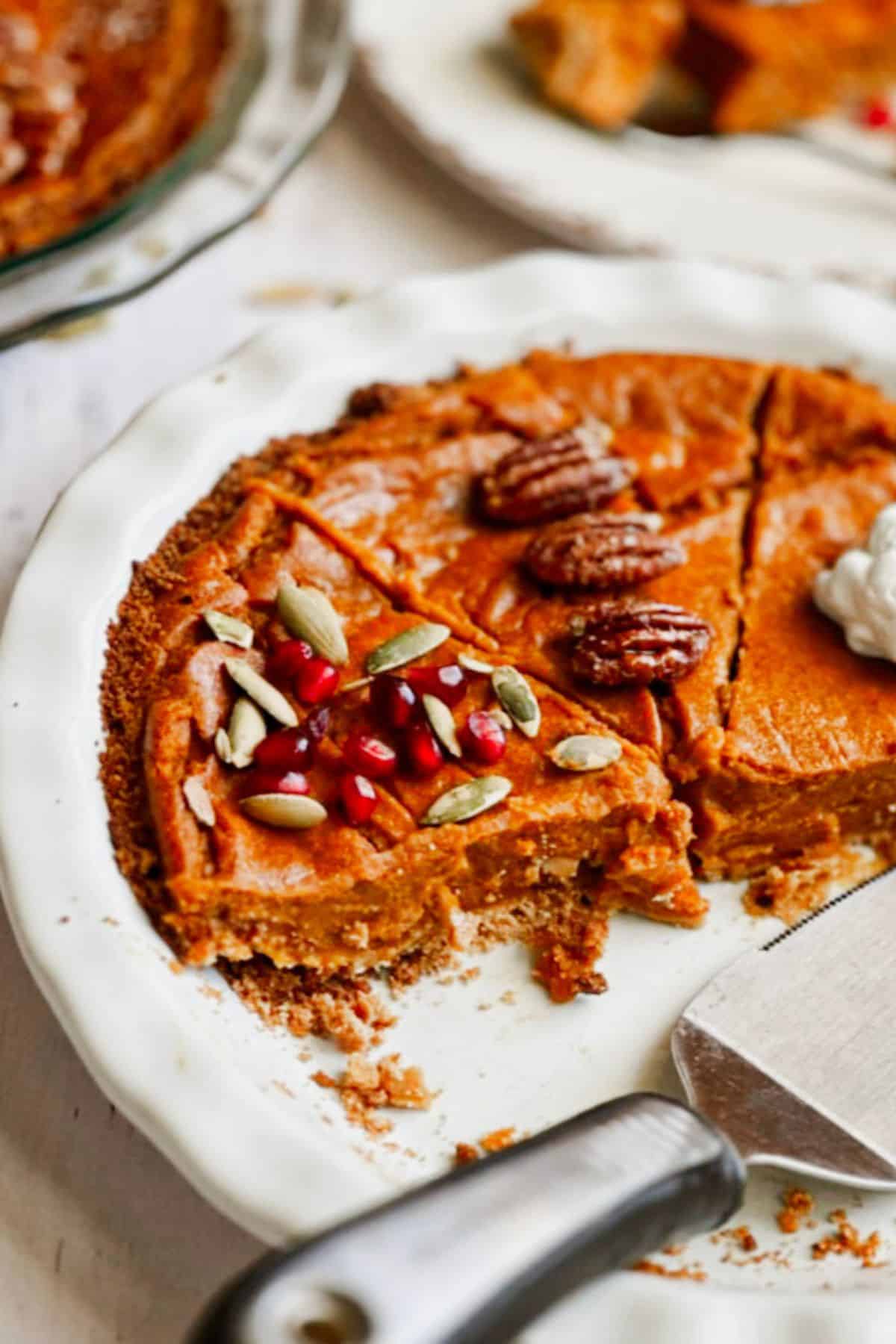 Slices of Vegan Pumpkin Pie with Graham Cracker Crust with different toppings