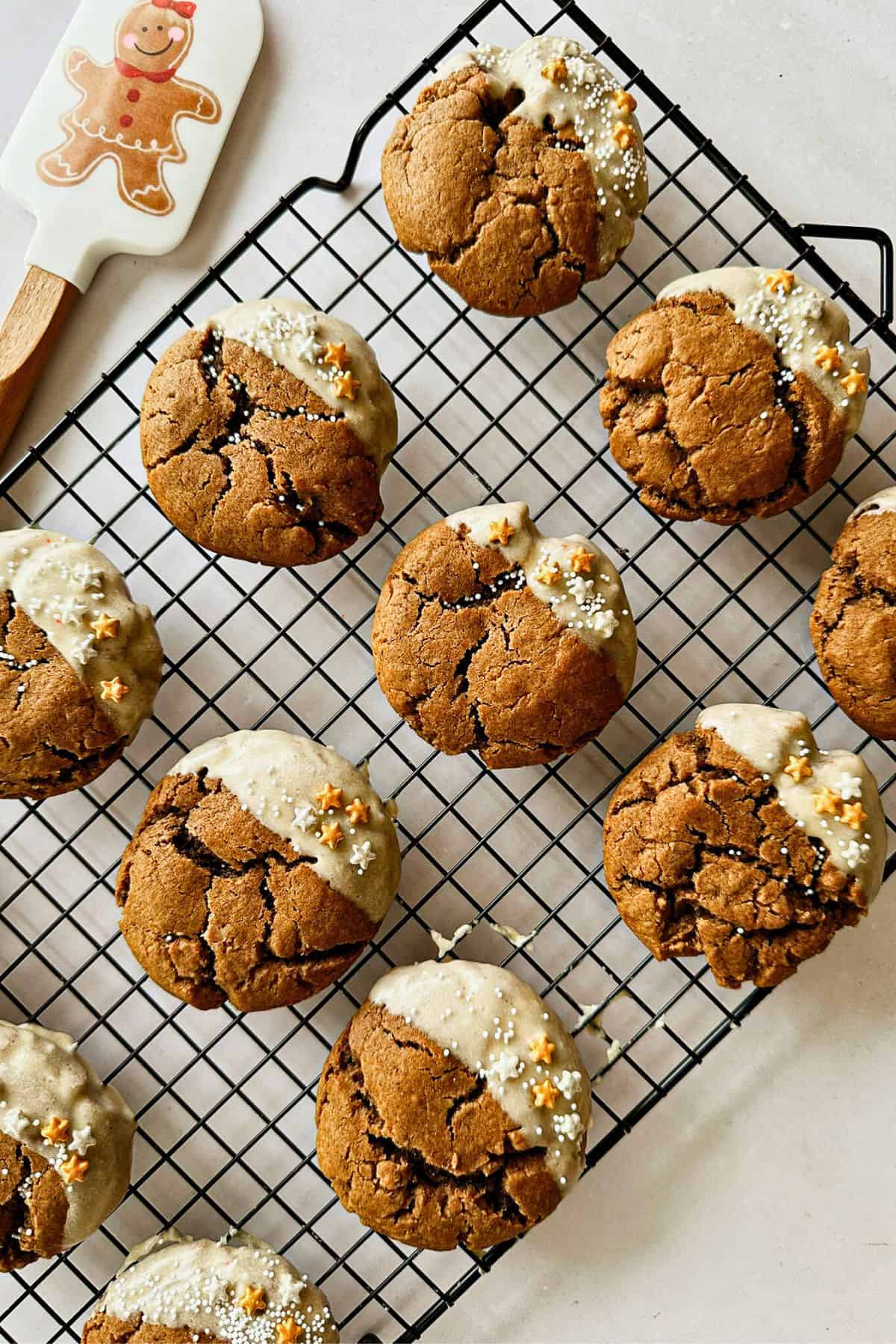 soft vegan gingerbread cookies with maple syrup glaze on a cooling rack