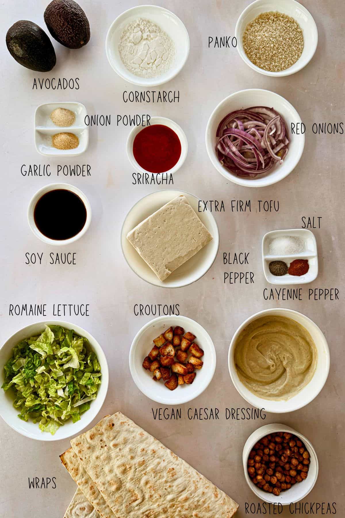 top view of spicy vegan Caesar tofu wrap ingredients in bowls