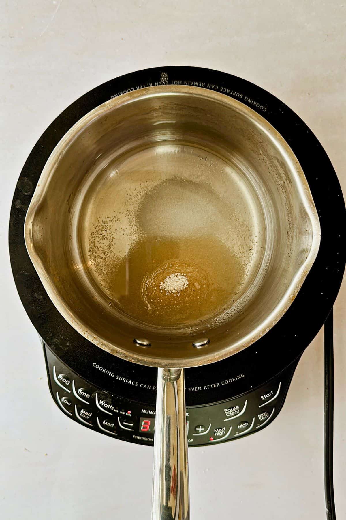 sugar mixture for the sushi rice boiling in the pot