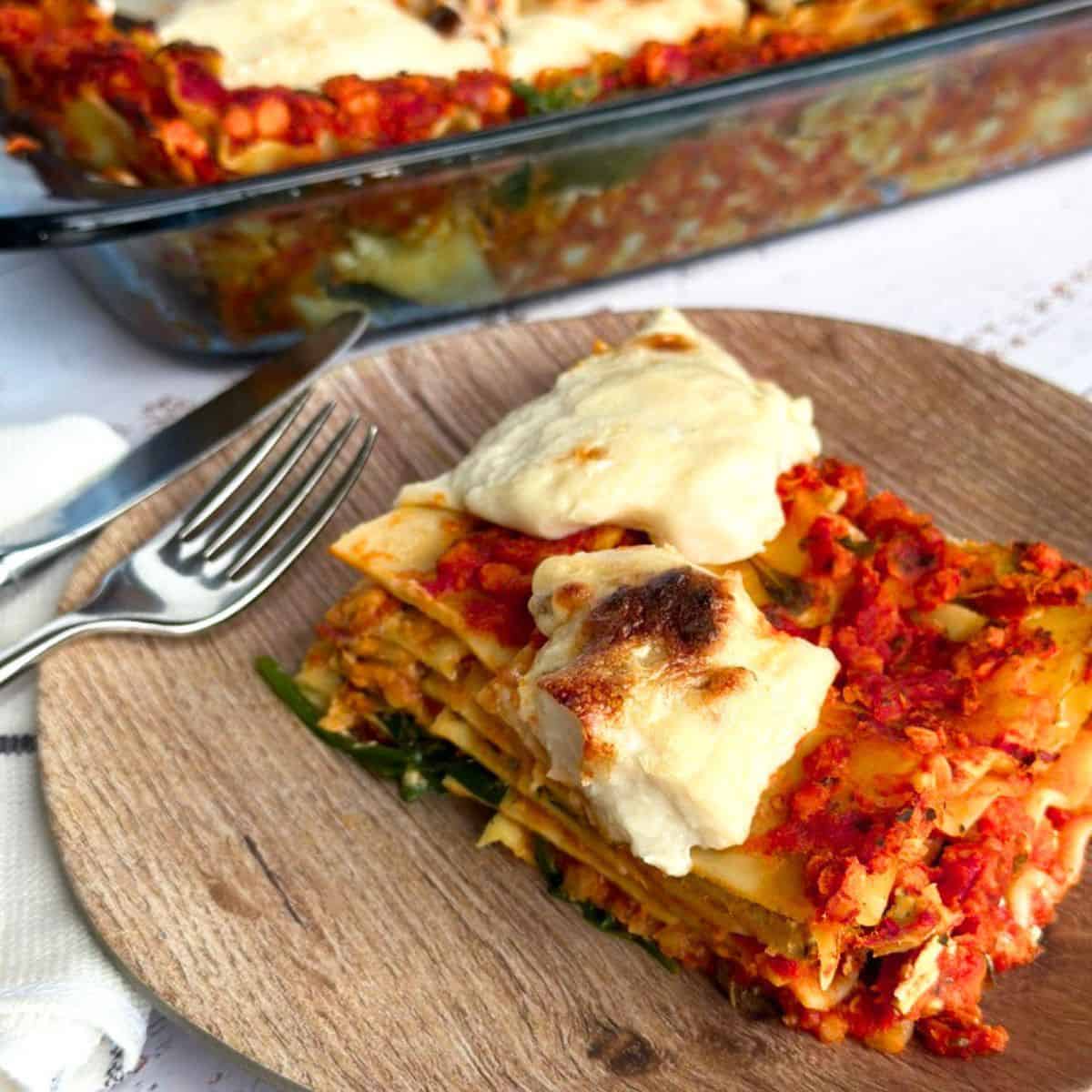 slice of vegan lasagna with homemade mozzarella on a plate