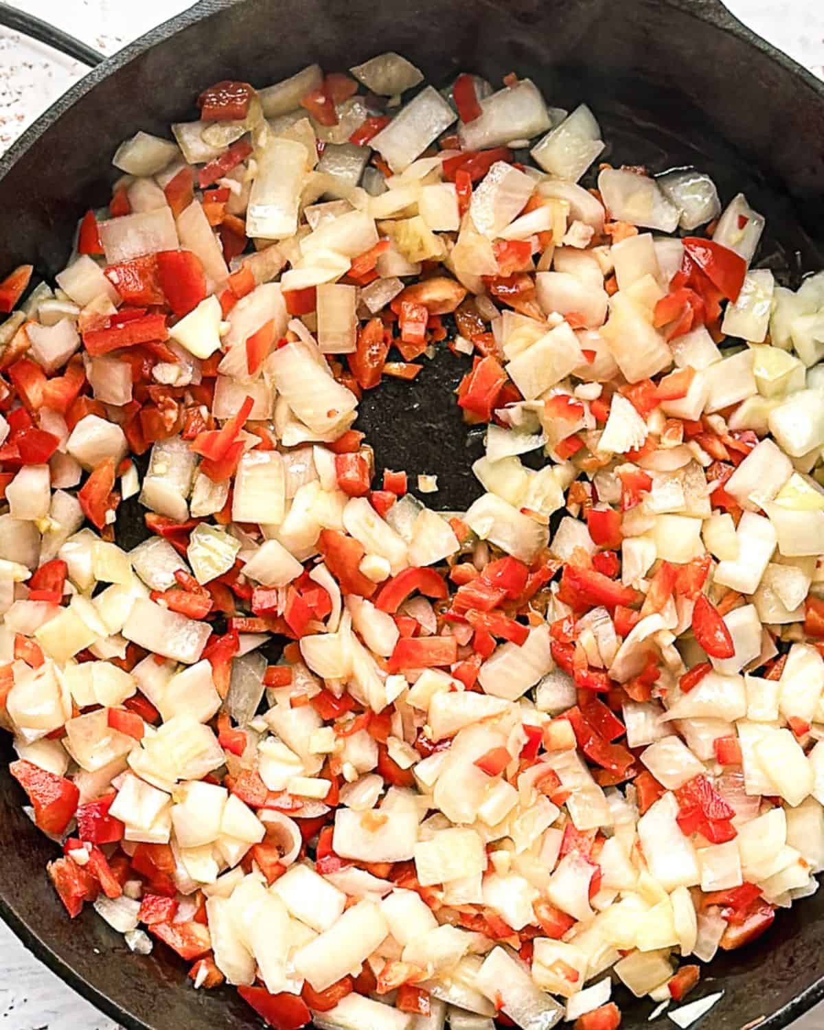 Step 3: add onions, peppers, and garlic and saute in a skillet.