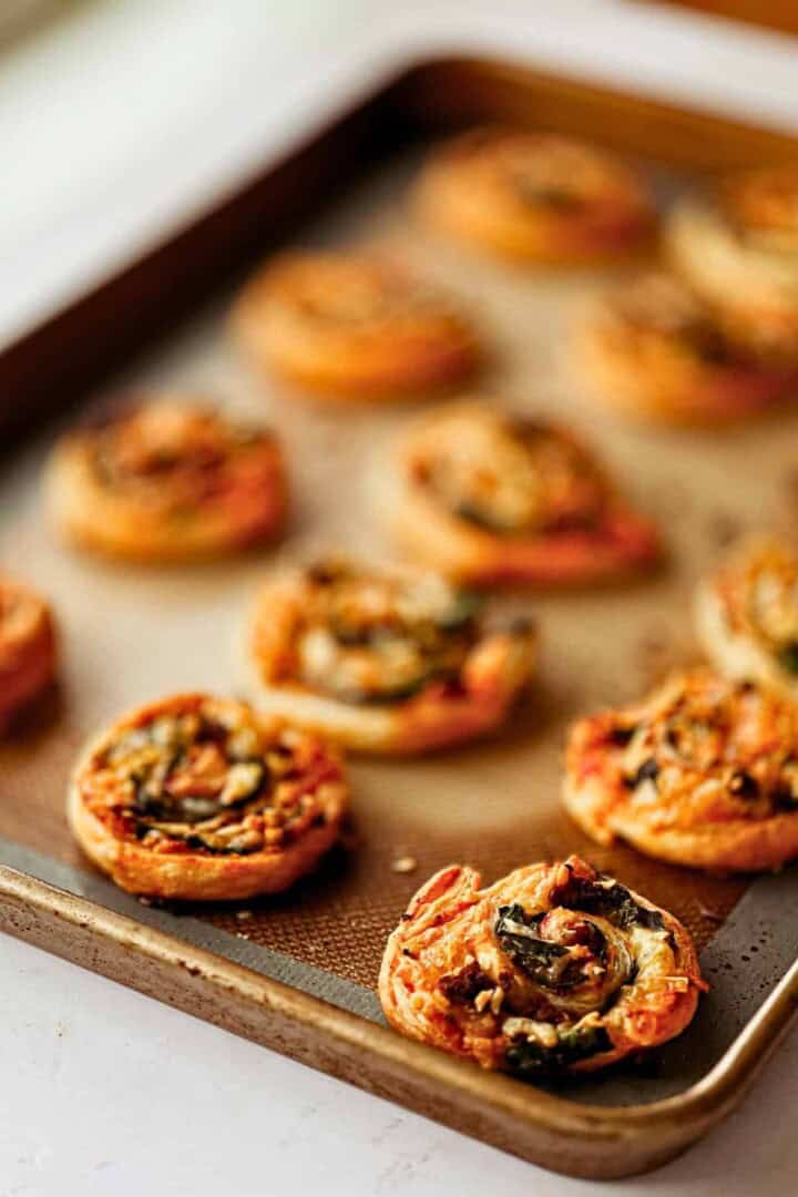 vegan pizza rolls on a baking tray; side view