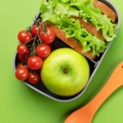 pin showing a lunch box full of food.