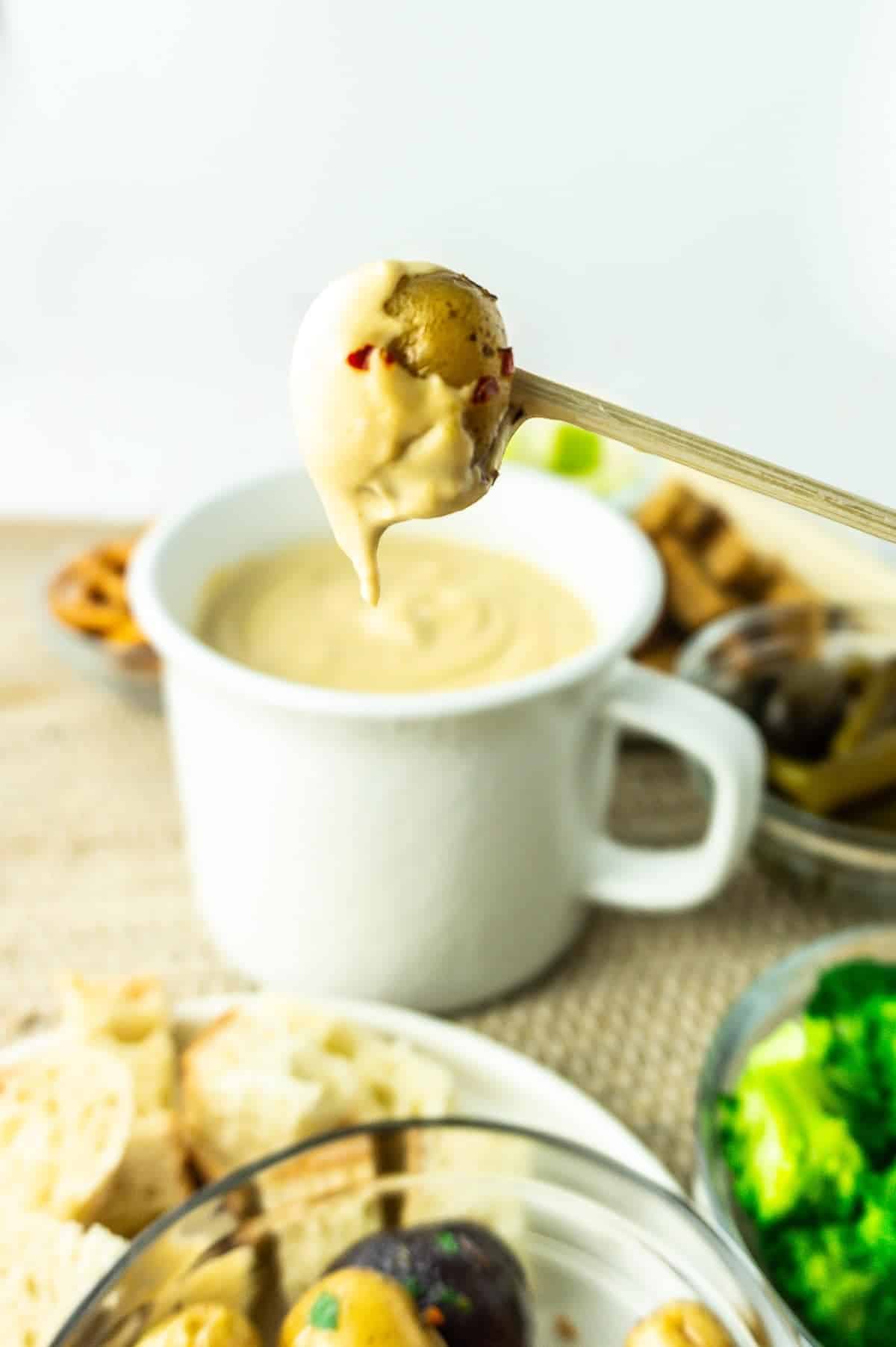 potato dipped in cheese fondue