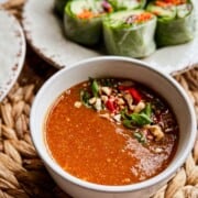 side angled view of Thai Peanut Sauce in a bowl.