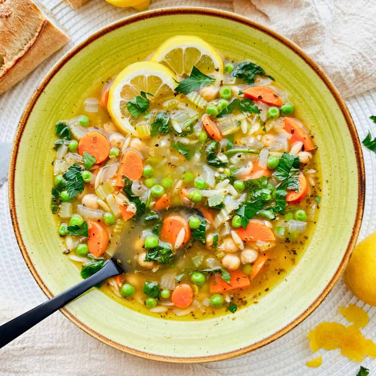 bowl of Lemony Orzo Chickpea Soup.