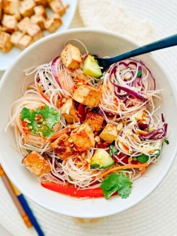 spring roll salad in a bowl with a fork.