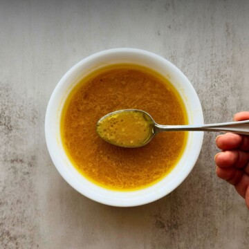 Miso Citrus Dressing in a bowl with a spoon picking some up.