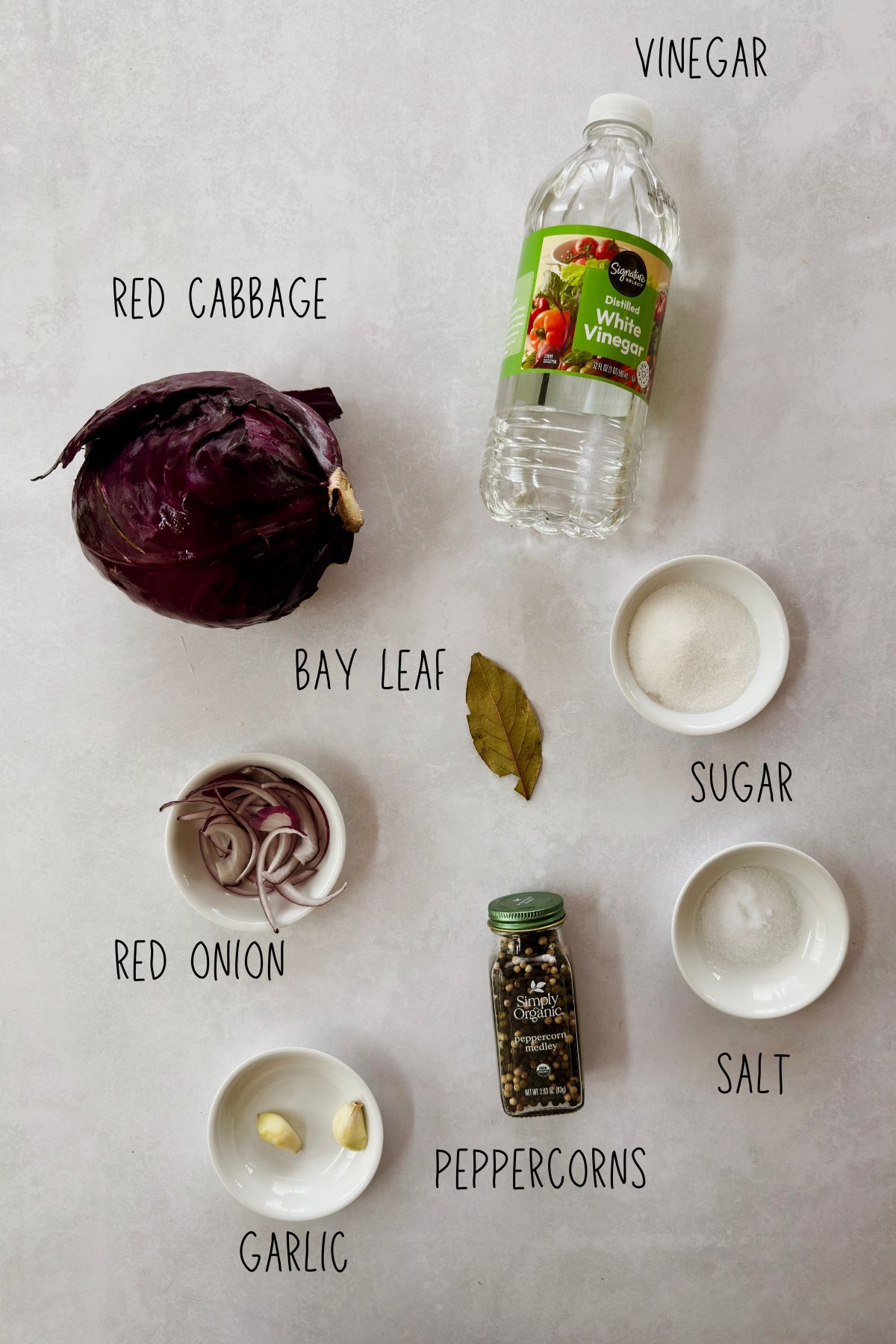 The images show the process of making quick pickled red cabbage, from shredding the cabbage and heating the brine on the stovetop, to packing it into a mason jar and pouring the brine over it.