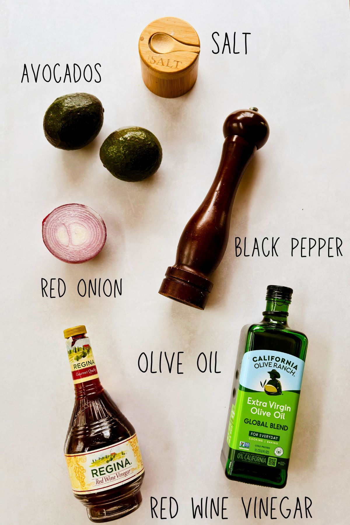 Ingredients for Cuban avocado salad: avocados, red onion, red wine vinegar, olive oil, salt, and black pepper.