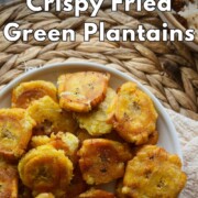 Pinterest graphic reading “How to Make Crispy Fried Green Plantains - Tostones” over a bowl of golden tostones.