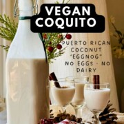 Pinterest graphic reading “Vegan Coquito - Puerto Rican coconut eggnog, no eggs, no dairy, 20 minutes, 10 ingredients” over a bottle and three cordial glasses.